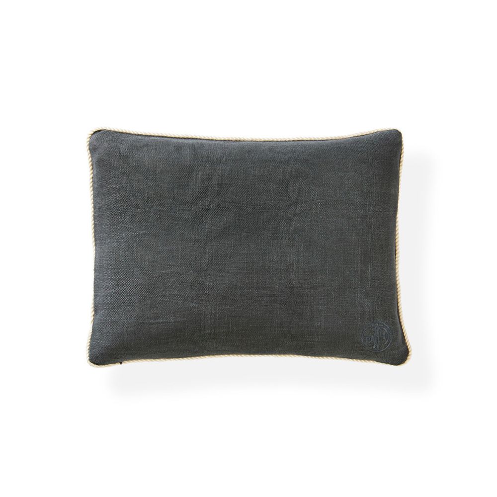 A modern linen cushion with a stylish, geometric matrix triangle design and corded edge 