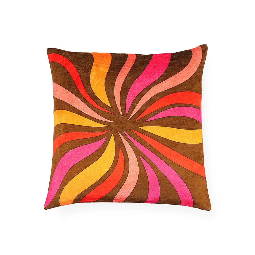 Firey design velvet cushion with warm tones on a brown background