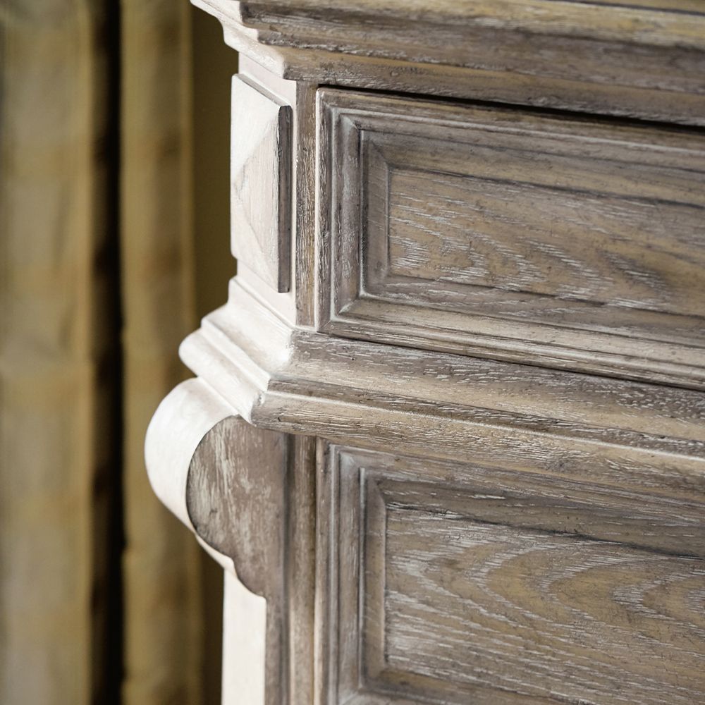 A classic and timeless dresser featuring a natural white oak veneer finish and eight spacious drawers