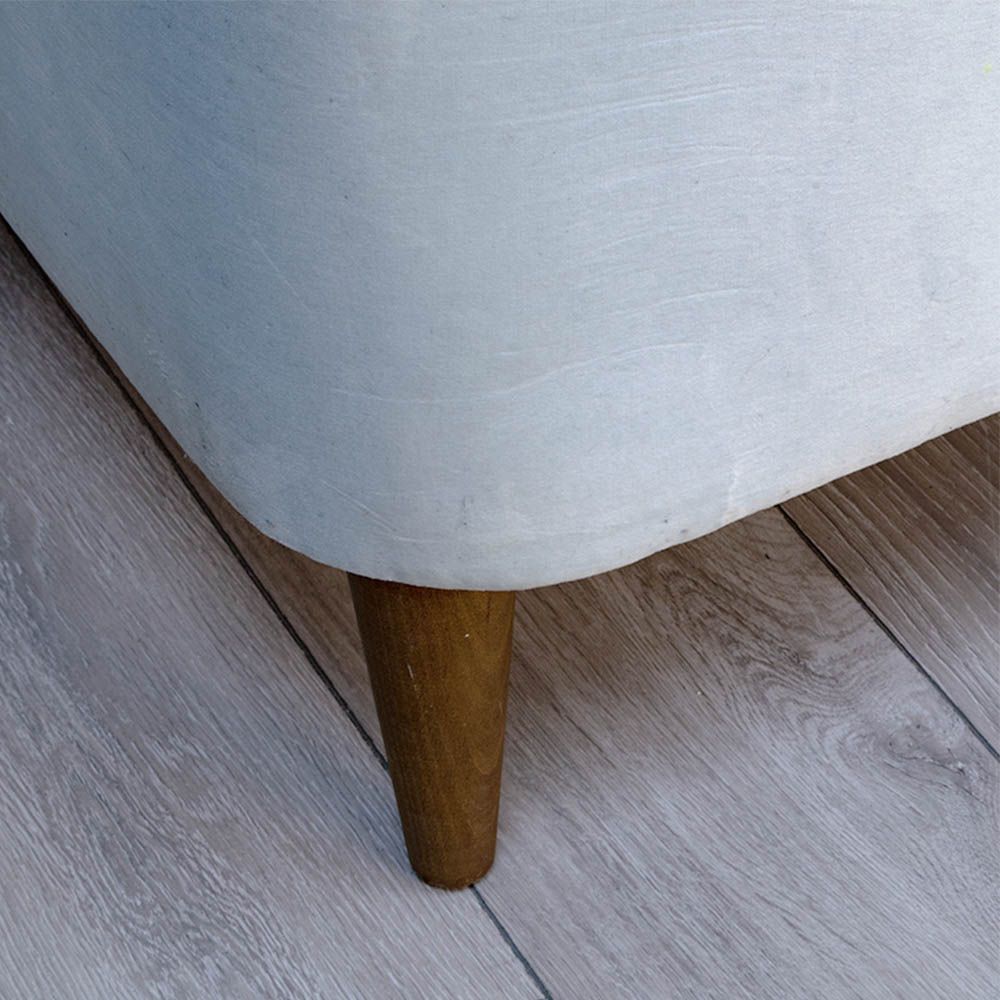 A curvaceous chaise longue with a pale blue velvet upholstery and seashell-like frame 