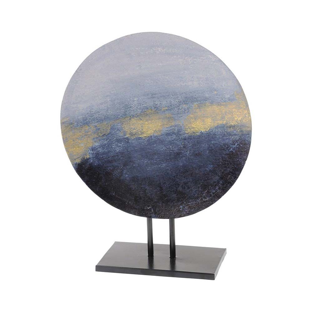 An elegant iron cast sculpture with touches of white, blue and gold