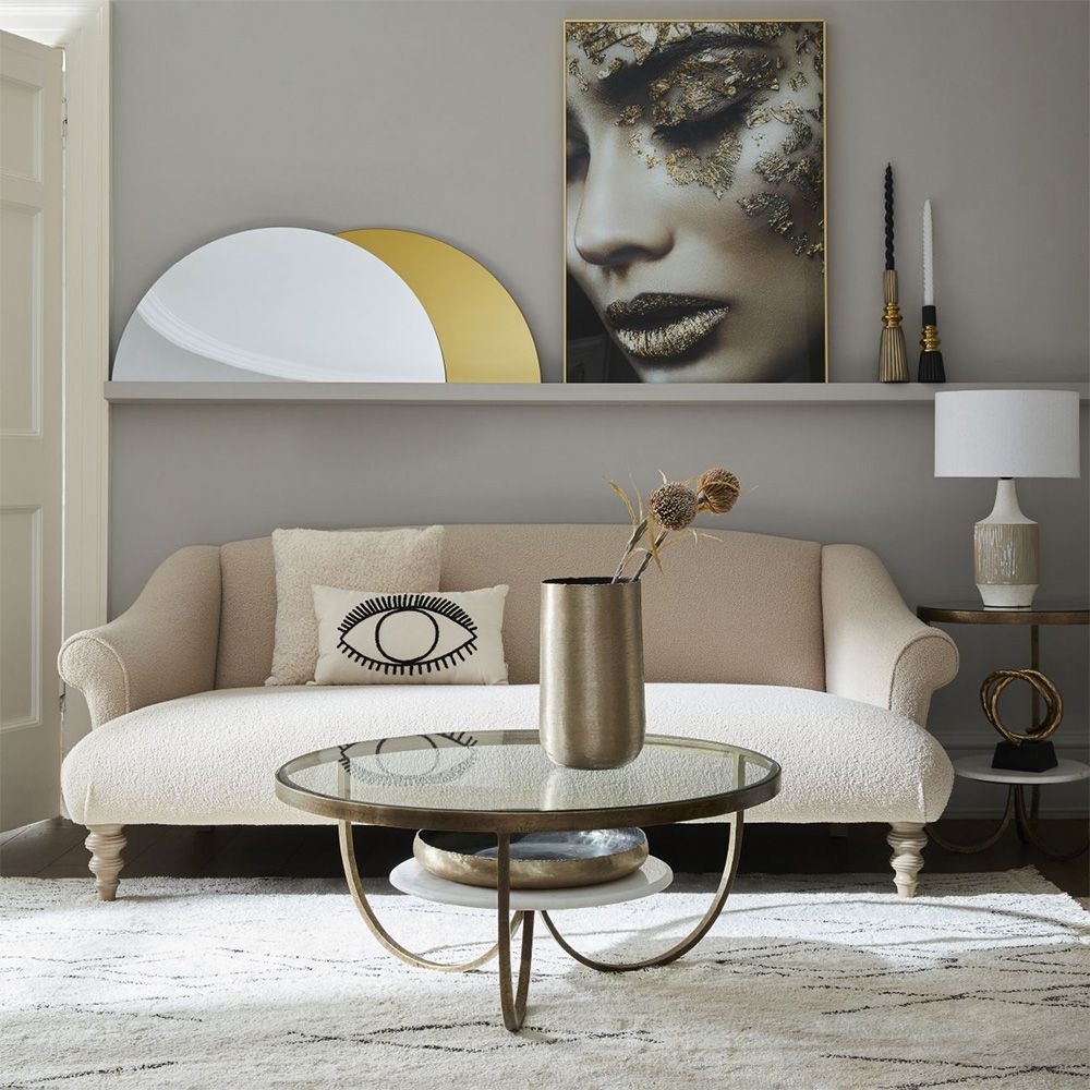 Enchanting Eclipse Coffee Table with white marble and antique gold details.