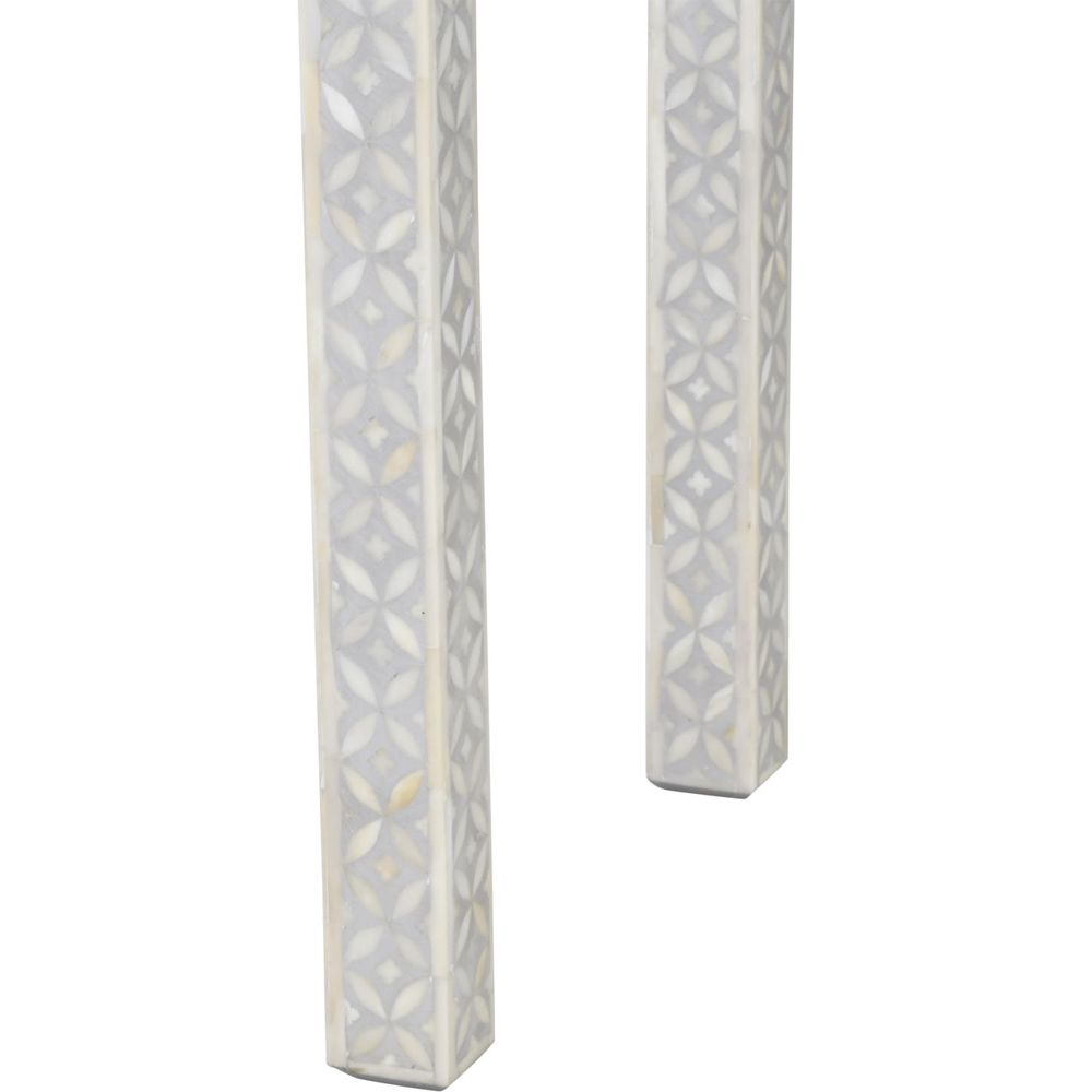A luxurious grey console table with bone inlay details