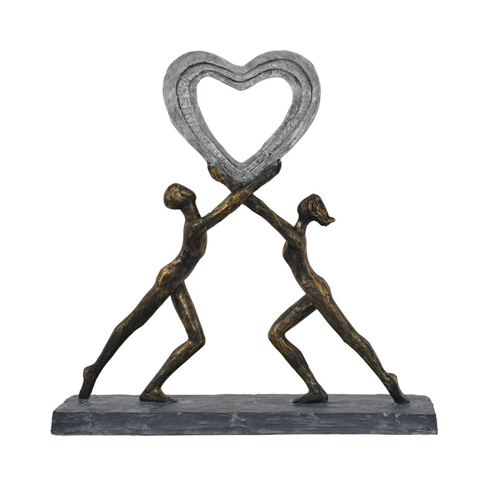 A beautiful, dark bronze sculpture of two figures holding up a heart which embodies love 
