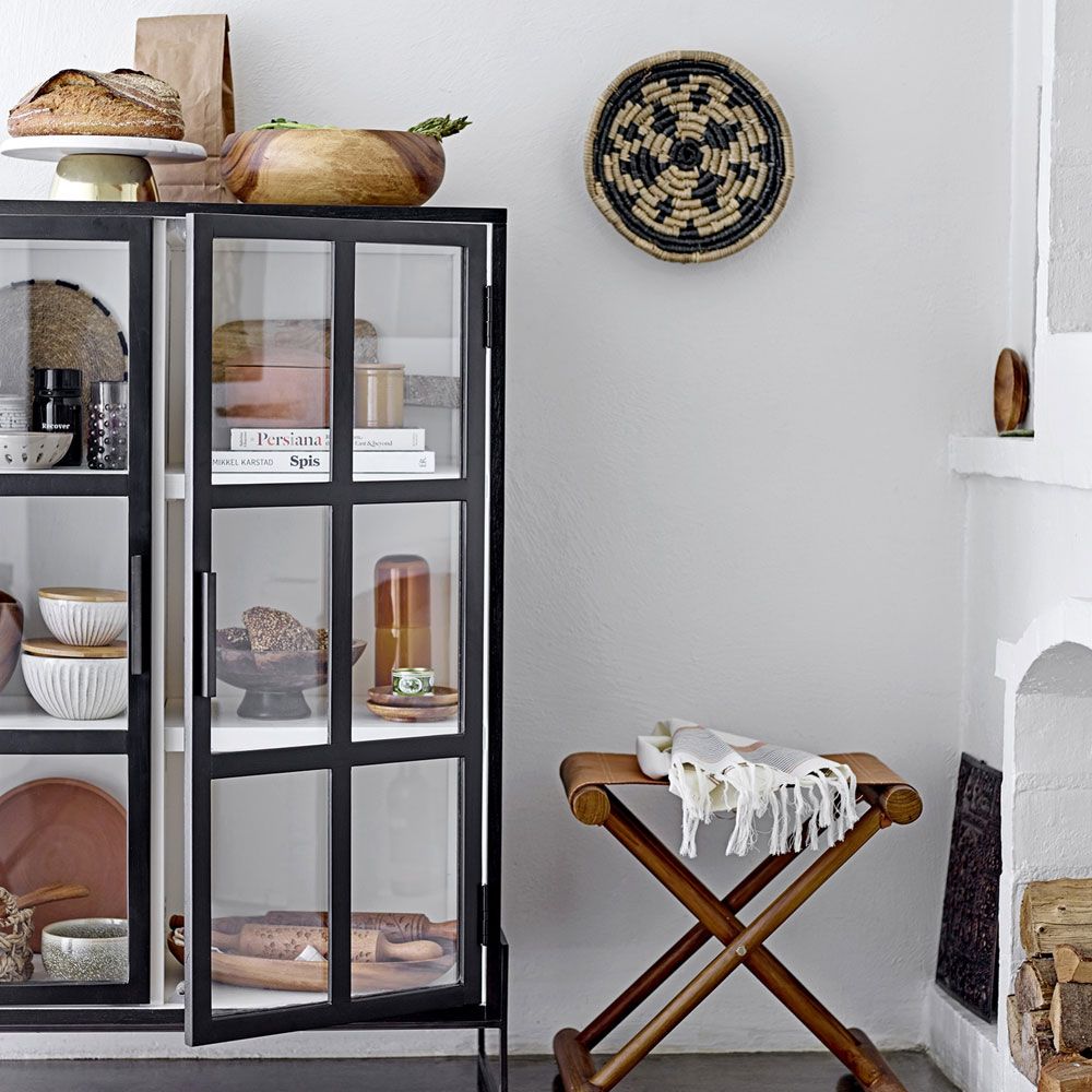 A chic, industrial-style display cabinet with a black oak and metal finish