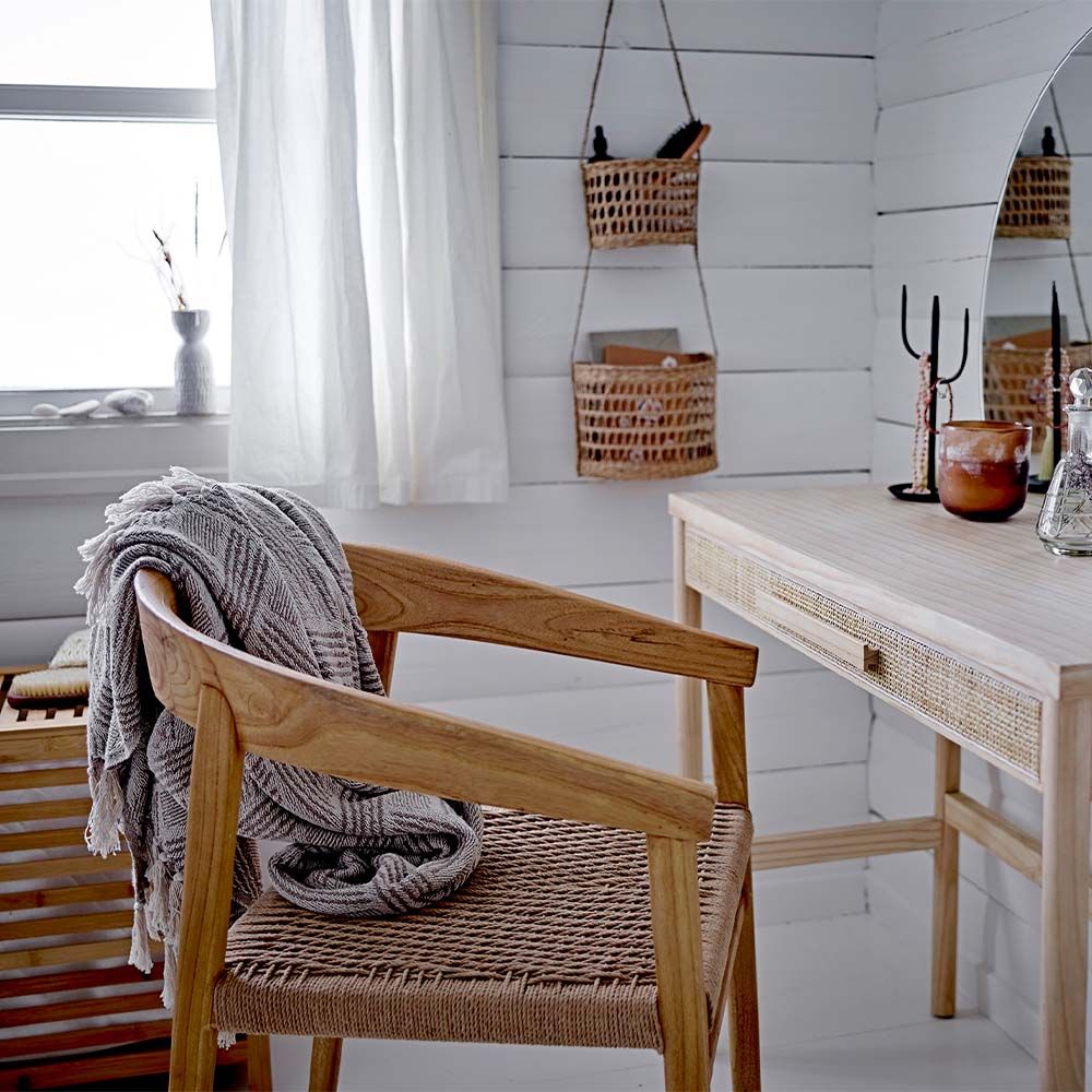 A scandi-inspired light oak chair with a braided seat