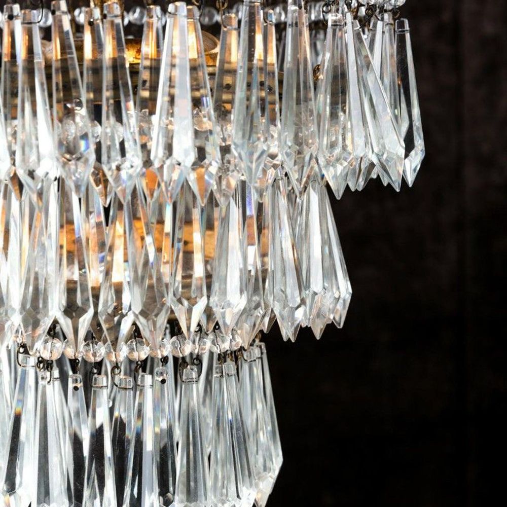 Antique gold chandelier with hanging beads and glass crystals