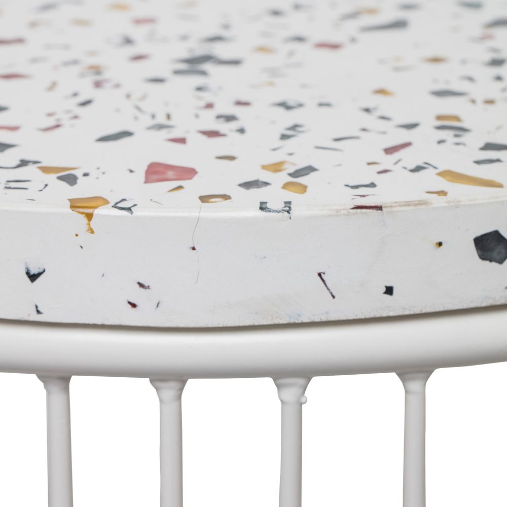 A luxurious fiberstone and iron side table