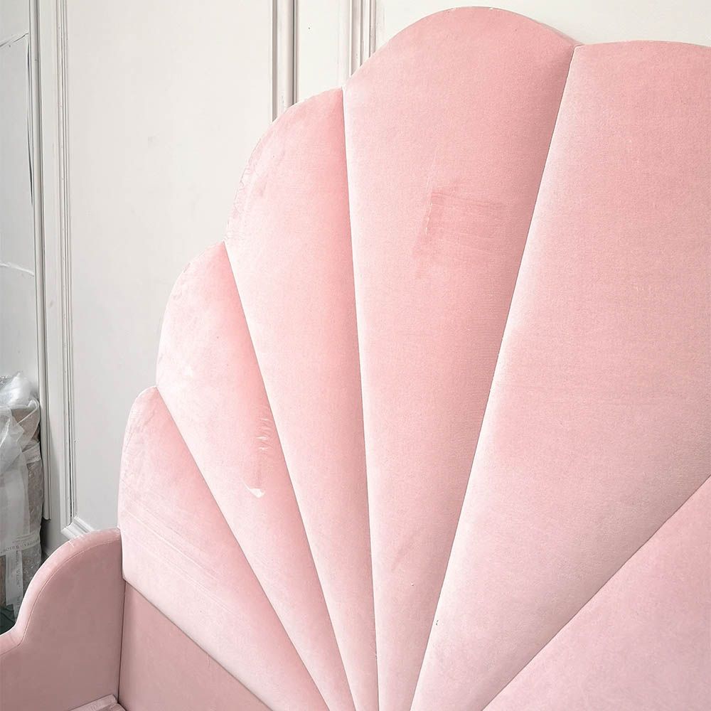 Gorgeous, statement kingsize bed with rounded, fluted headboard and blossom coloured upholstery