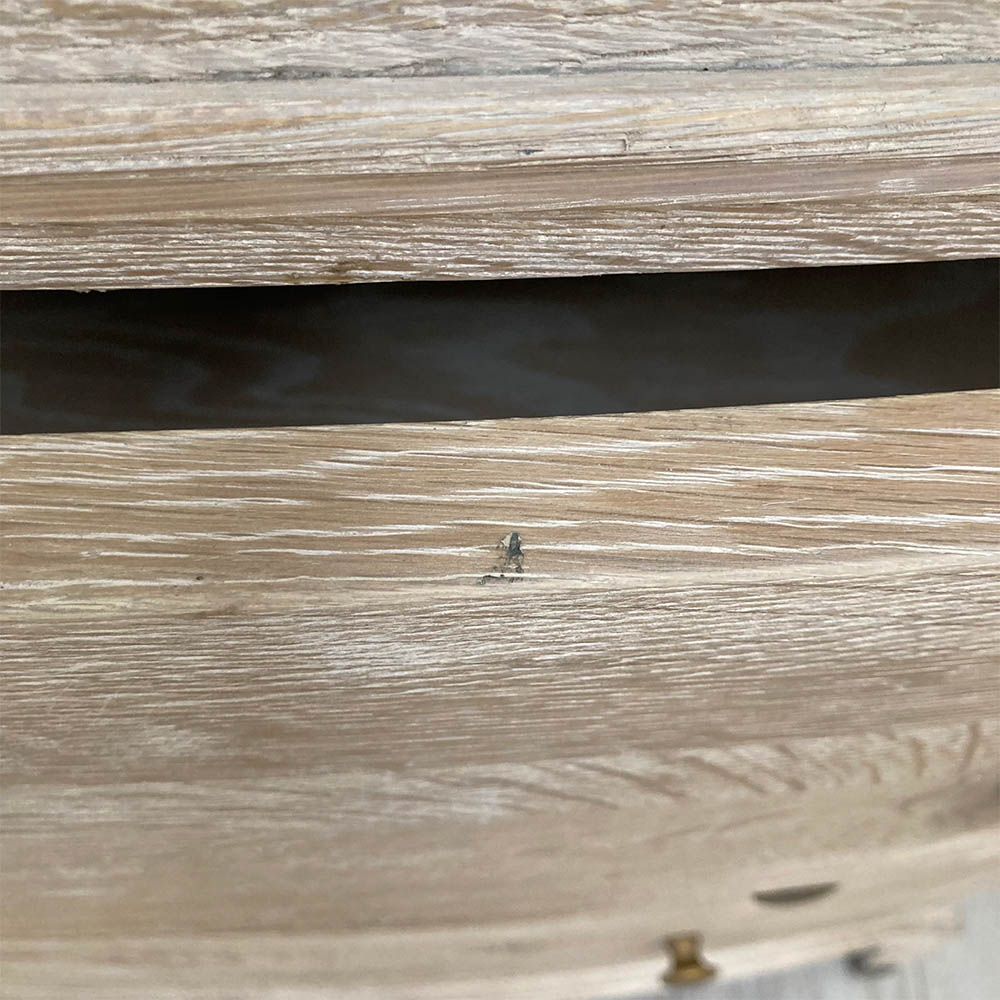 A stunning natural whitewash oak three-drawer chest with brass details