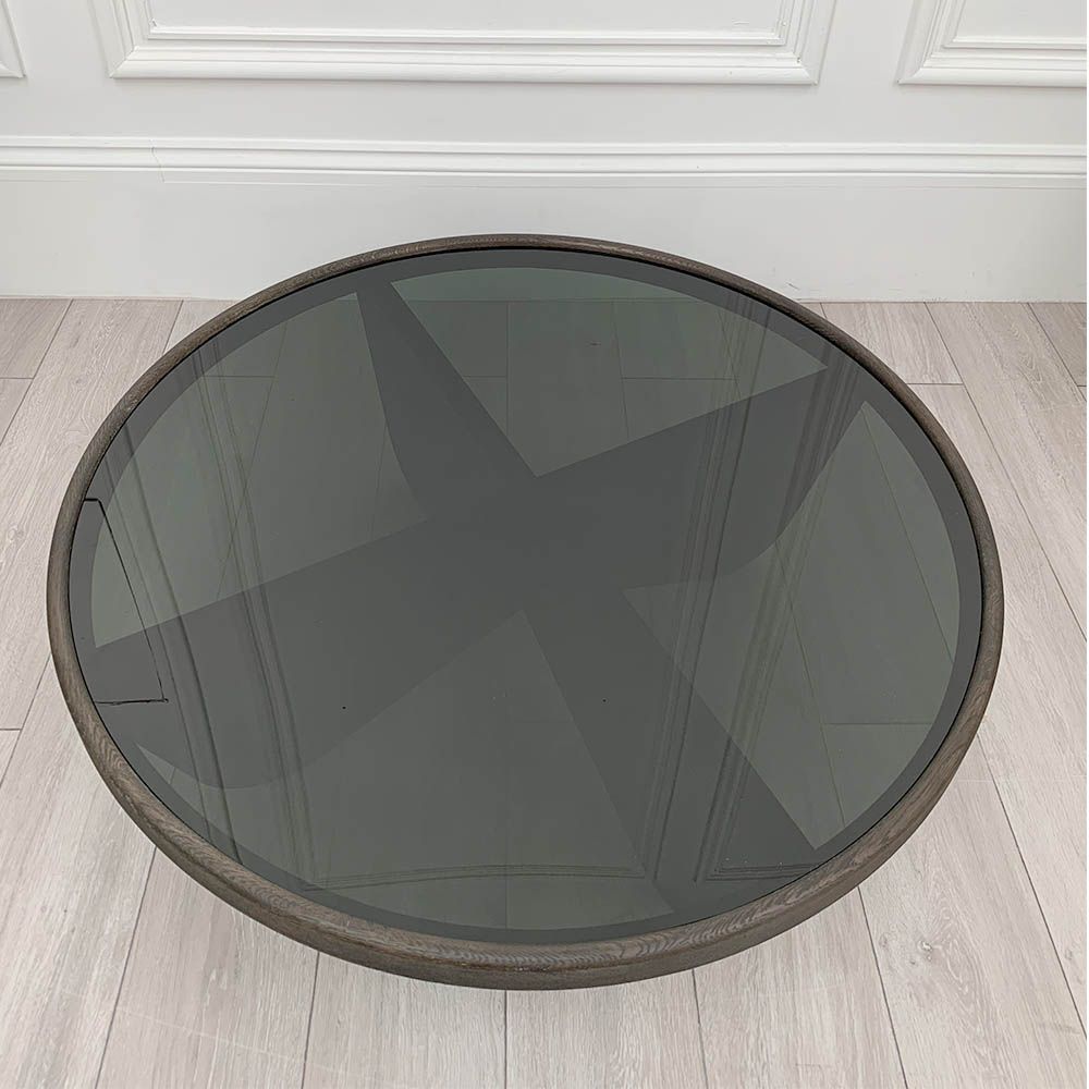 Elegant round coffee table with smoked glass table top