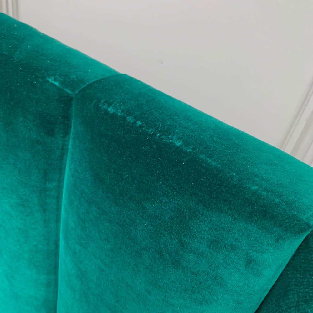 Stunning green velvet headboard with ribbing details and a missing bolt