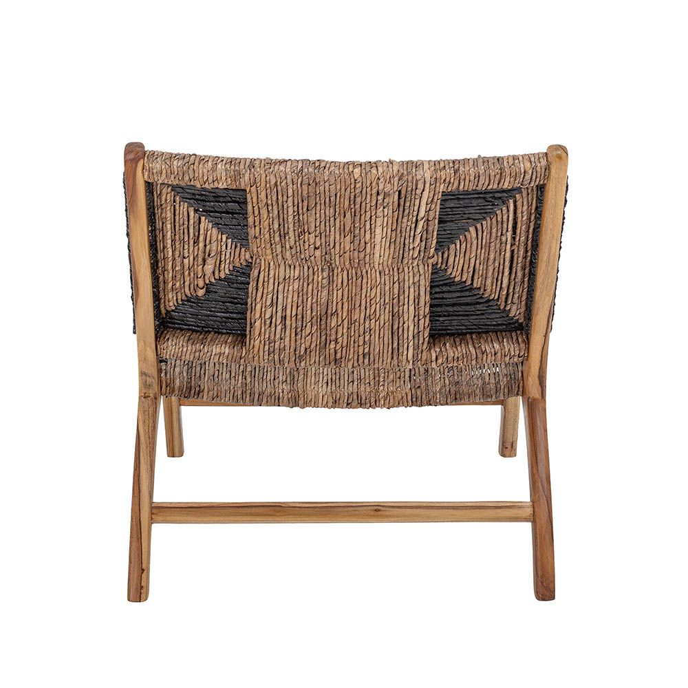 Enchanting laid-back lounge chair with black graphic pattern and natural textures.