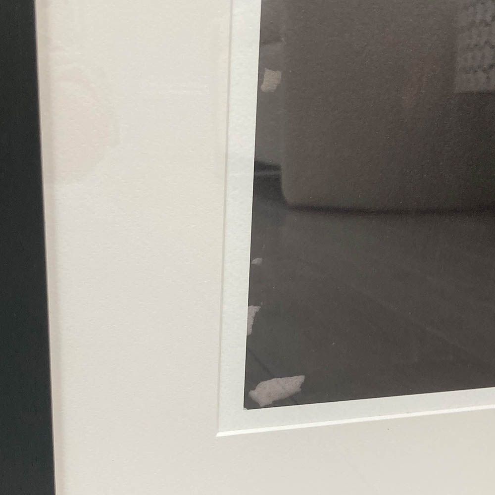 Abstract black and white print with black frame