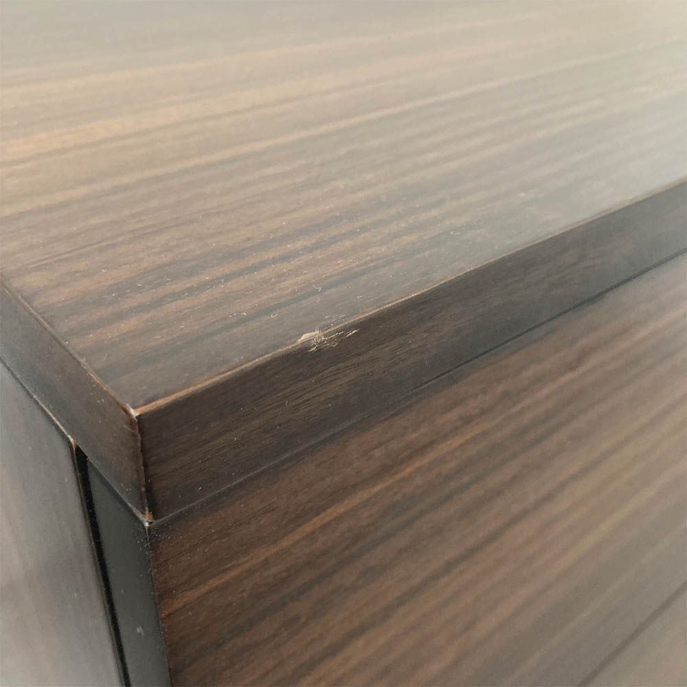 very minor mark on front left of bedside table