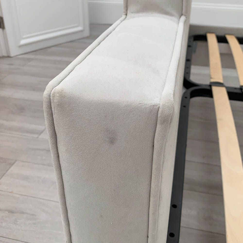 Slight mark on corner of bed footboard