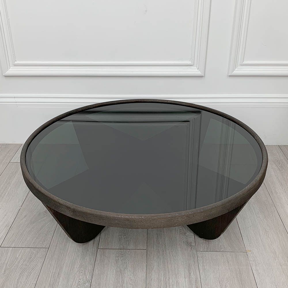 Elegant round coffee table with smoked glass table top