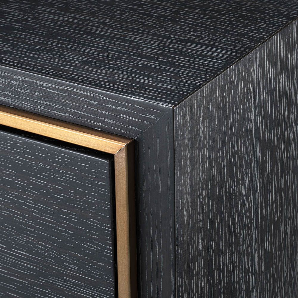 Elegant modern bedside table with dazzling brass details.