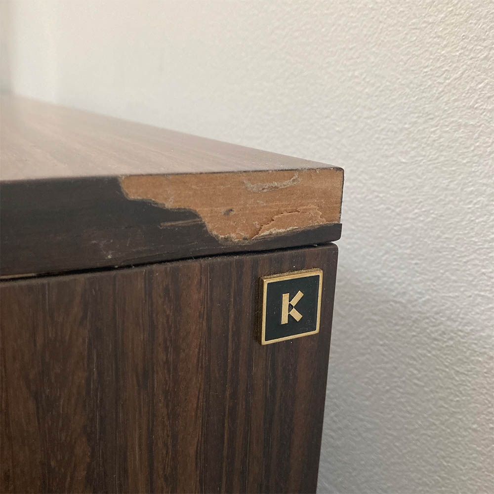chip to the back right corner of the bedside table