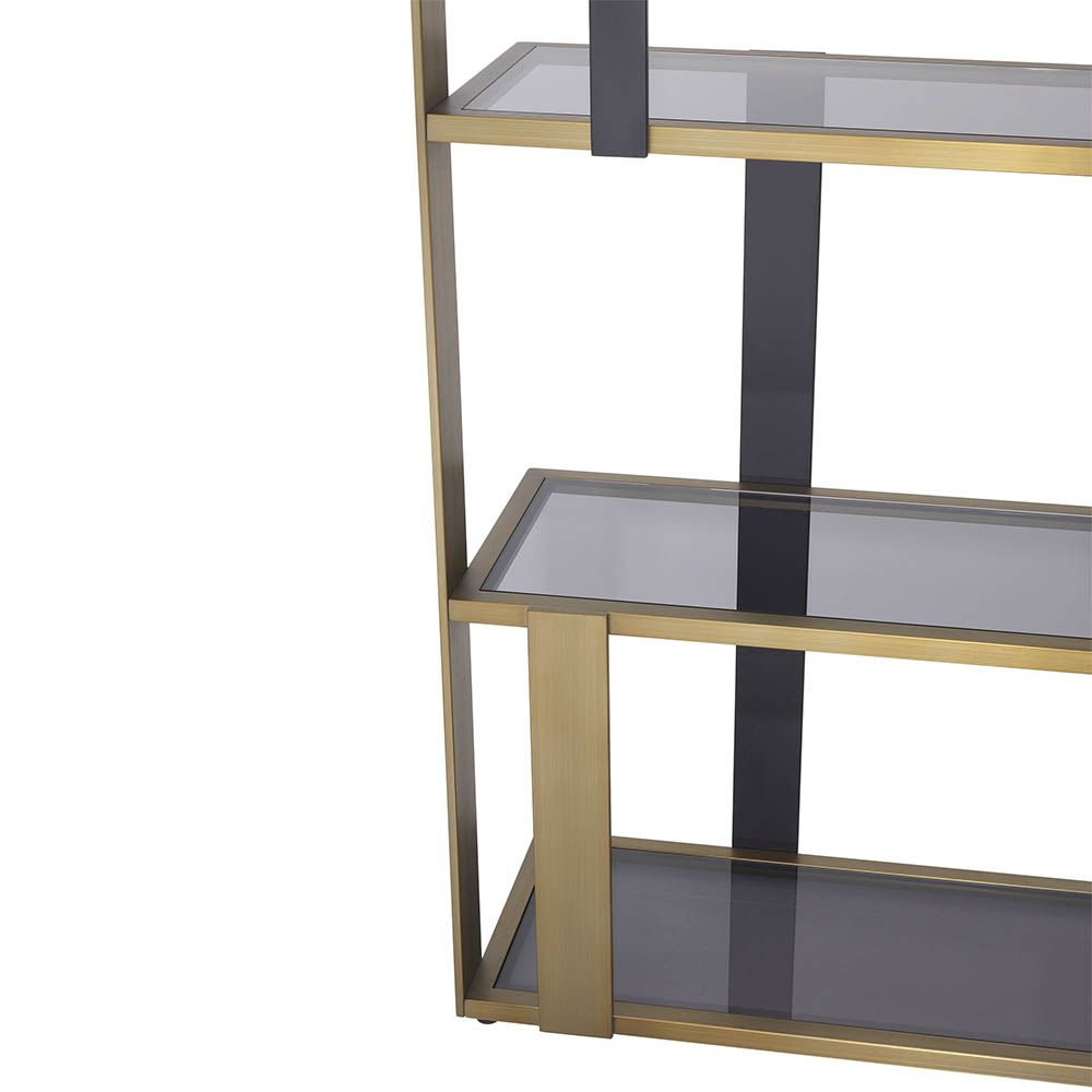 Elegant and glamorous shelving unit finished in brushed brass with geometric design