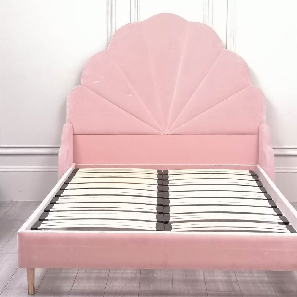 Gorgeous, statement kingsize bed with rounded, fluted headboard and blossom coloured upholstery