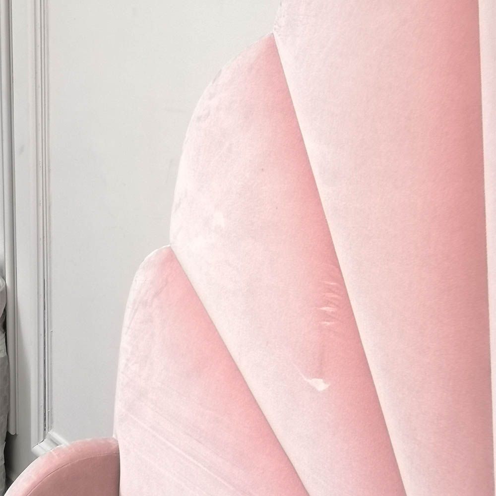 Gorgeous, statement kingsize bed with rounded, fluted headboard and blossom coloured upholstery