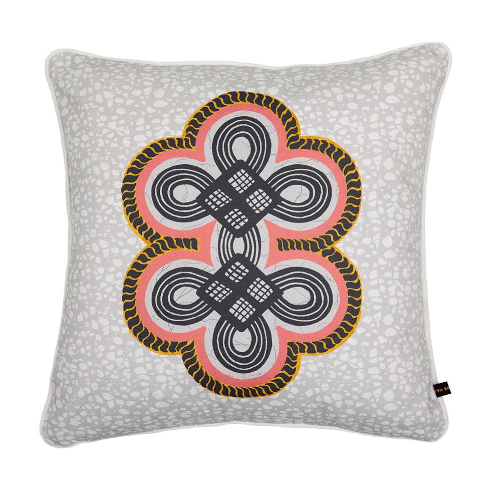 Alluring cushion with red, black and yellow twisting pattern against grey batik background