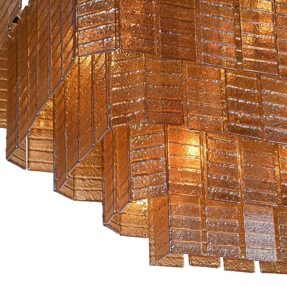 Amber toned chandelier made up of glass panels
