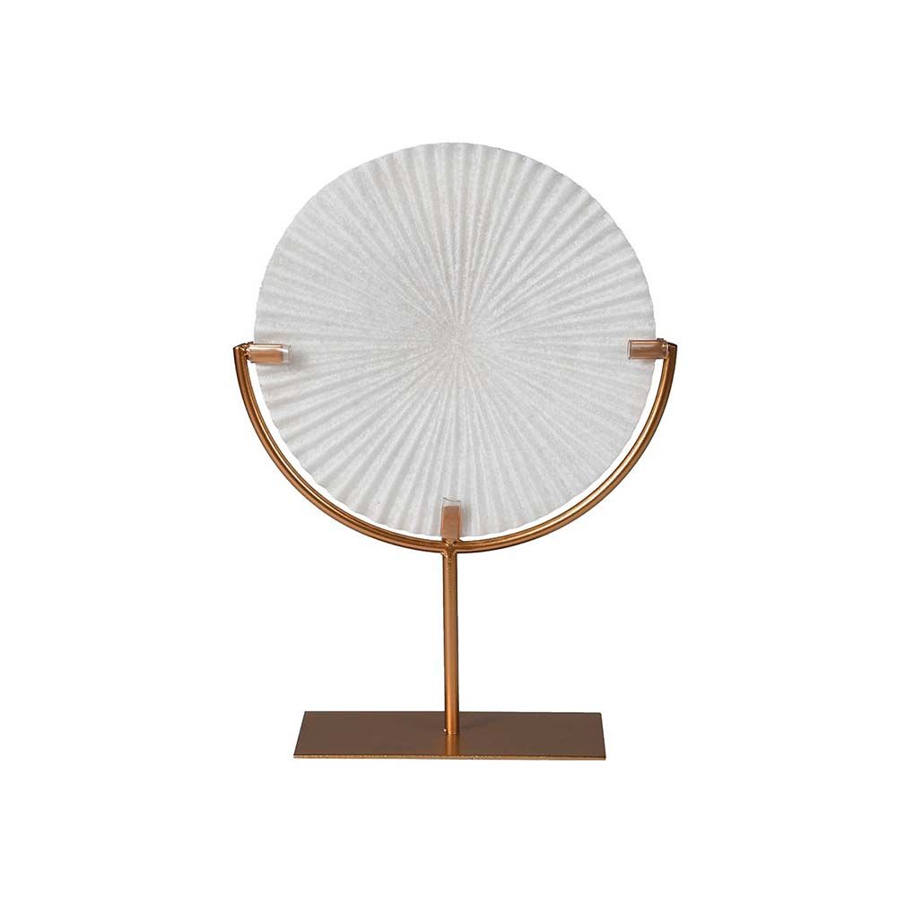 A petite decorative object with shell-like grooves and a brass stand