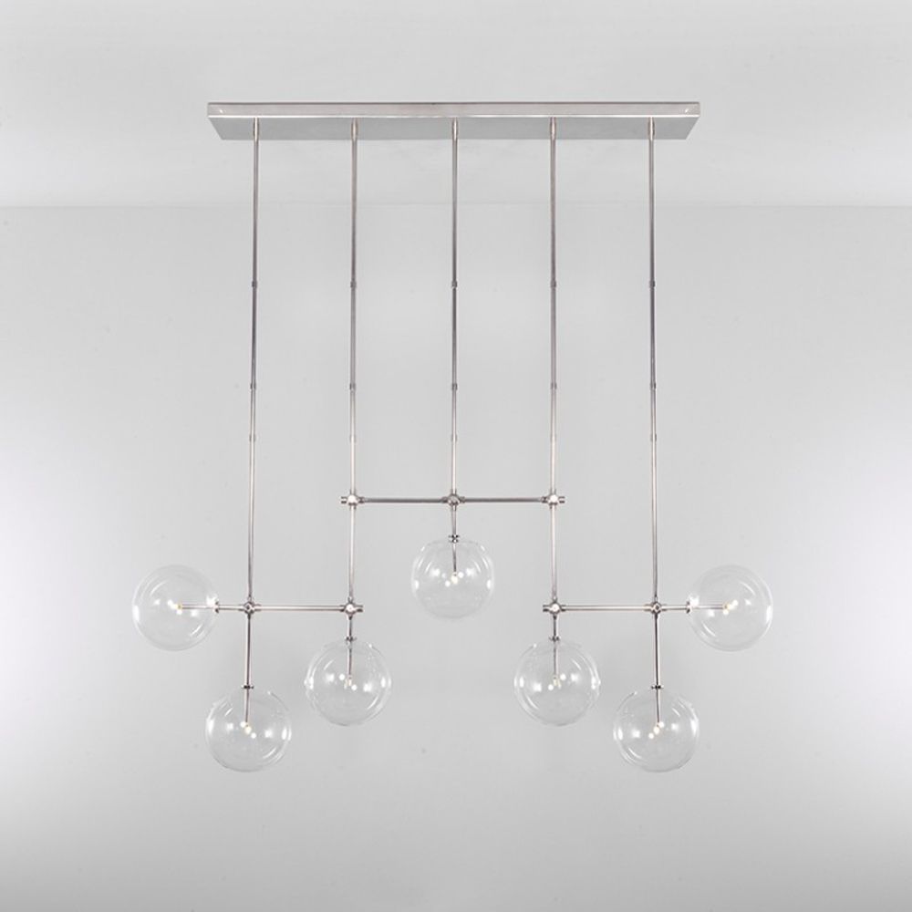 Polished nickel industrial sleek chandelier with hanging clear glass globe design