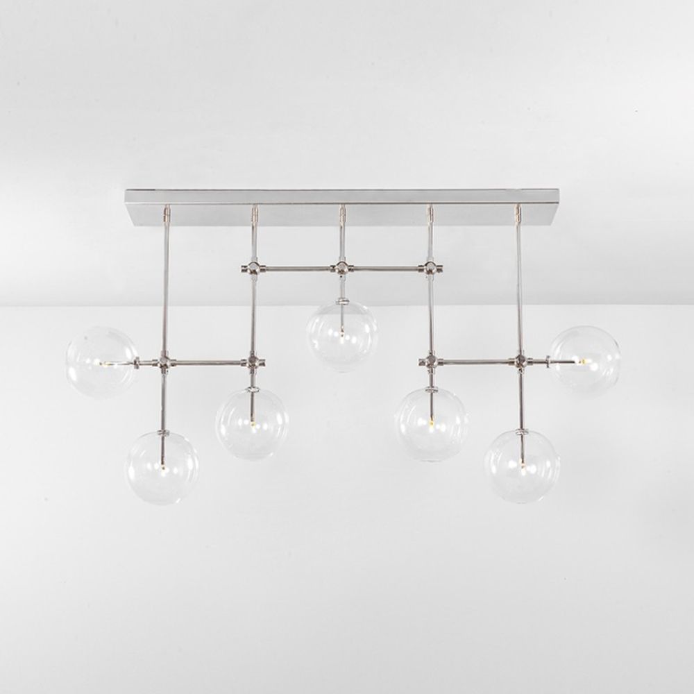 Polished nickel industrial sleek chandelier with hanging clear glass globe design