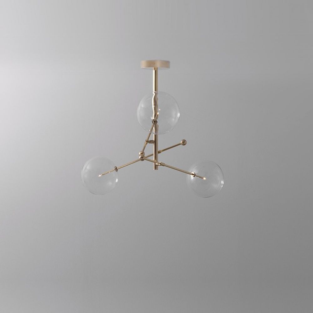 Natural brushed brass industrial style 3 arm chandelier with clear glass globe bulbs