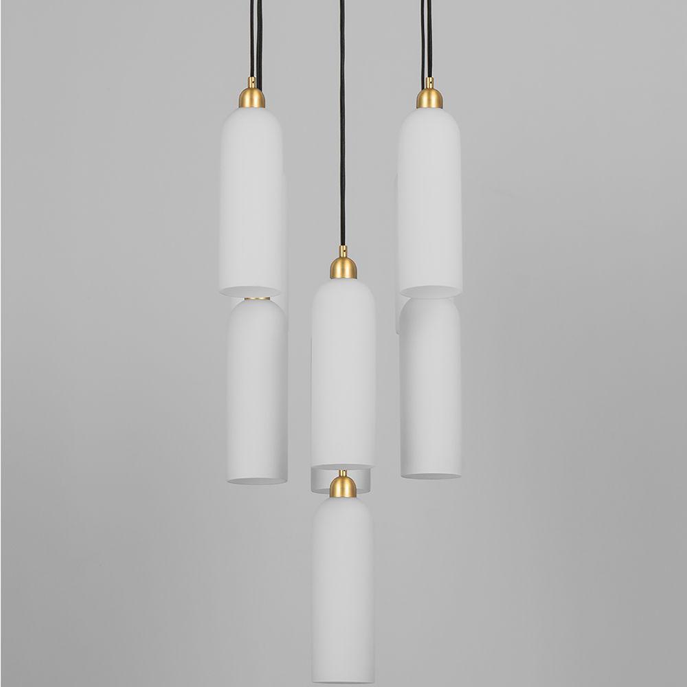 A luxury chandelier by Schwung with 9 frosted, opal glass shades and a stunning solid brass finish 