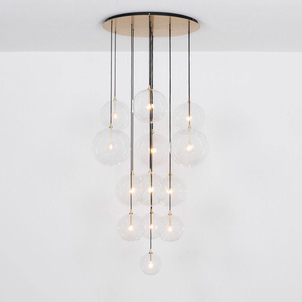 Glamorous industrial chandelier with multiple hanging clear glass globe lampshades