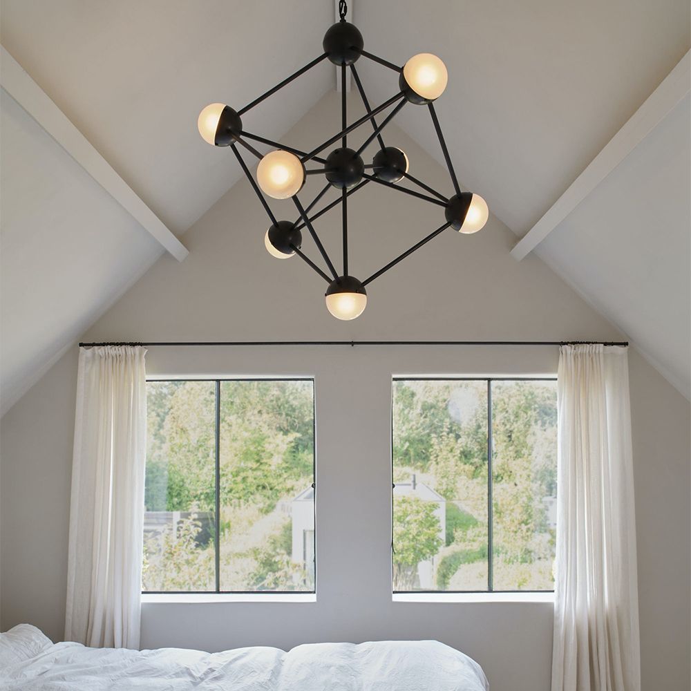 An industrial style chandelier by Schwung with a geometric design, seven transparent glass shades and a black gunmetal 