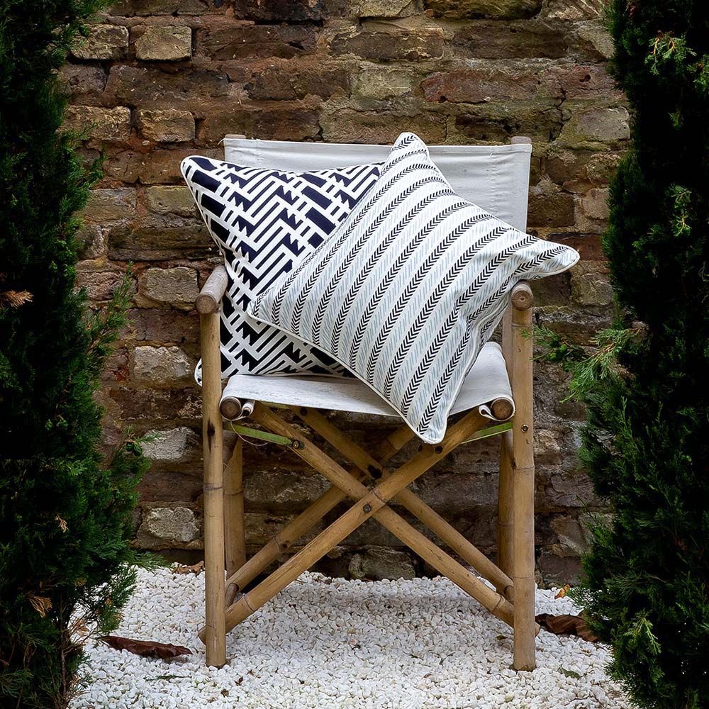 A gorgeous classic cushion with a subtle dark and light blue chevron pattern