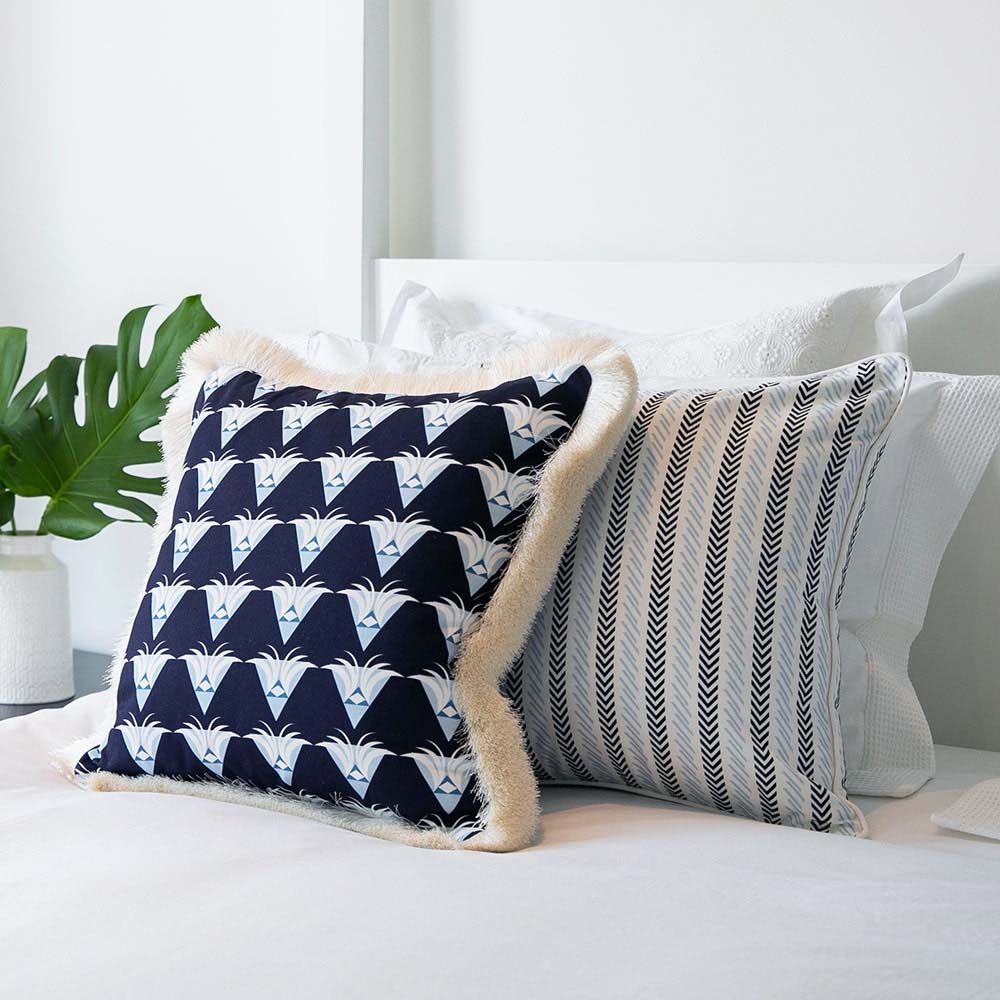 A gorgeous classic cushion with a subtle dark and light blue chevron pattern
