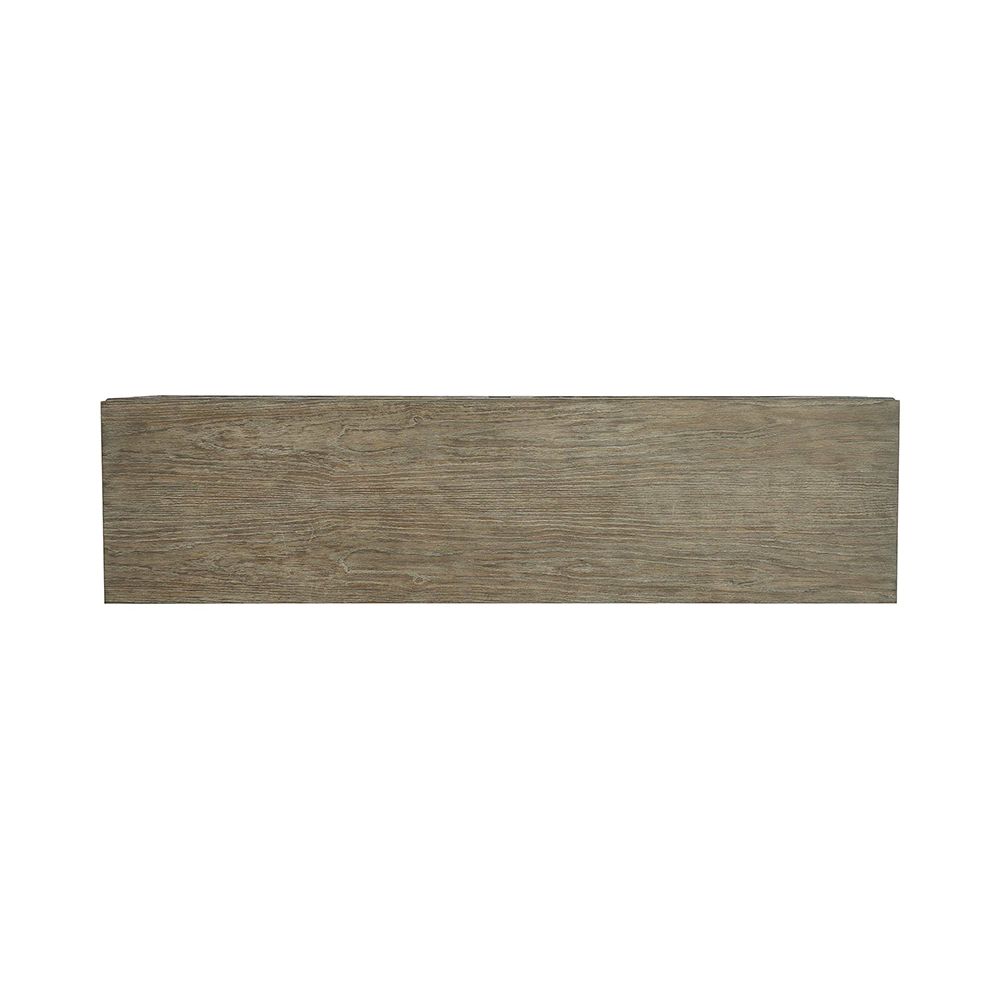 A textured wooden sideboard with four carved geometric patterned doors and finished with nickel plated aluminium legs