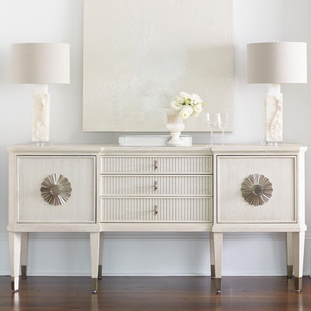 An exquisite sideboard with an elegant white finish, stunning silver highlights and floral inspired features