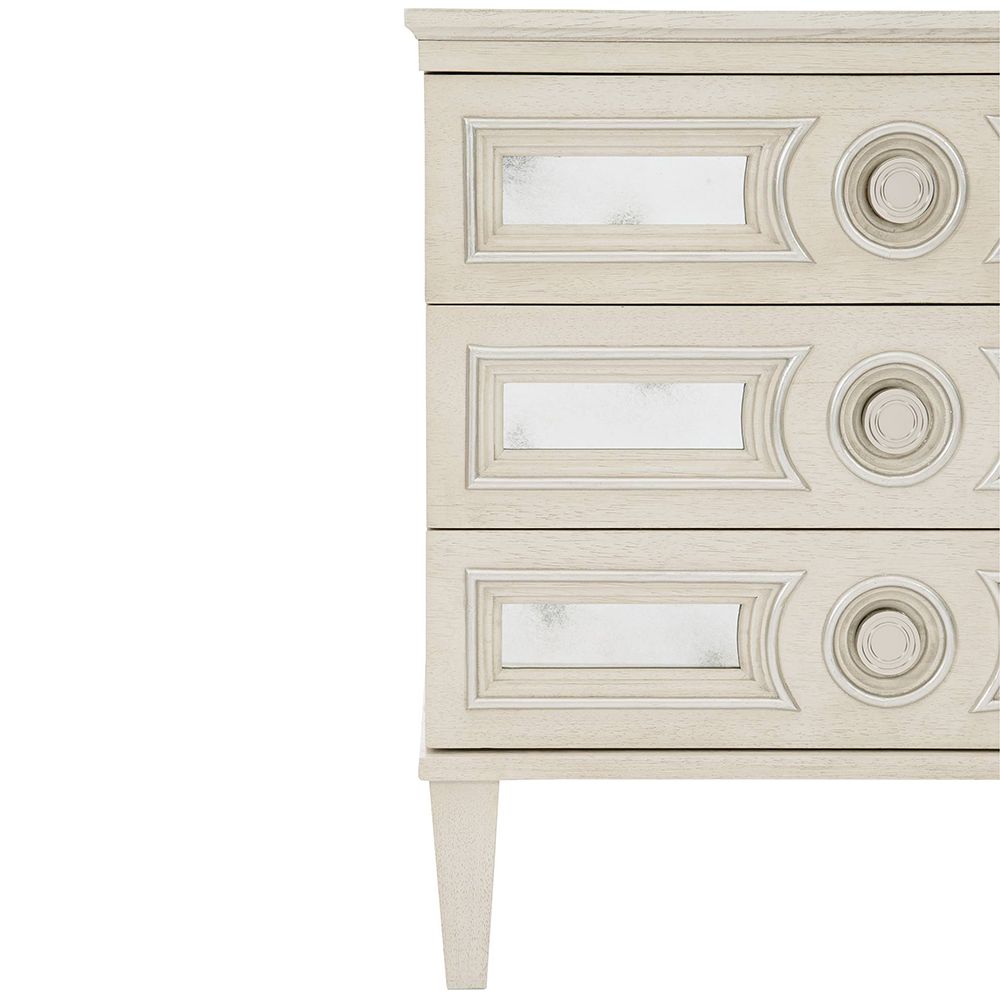 An alluring white oak veneer bedside table by Bernhardt with antique mirrored glass panels, Silver Luster highlights and a Manor White finish