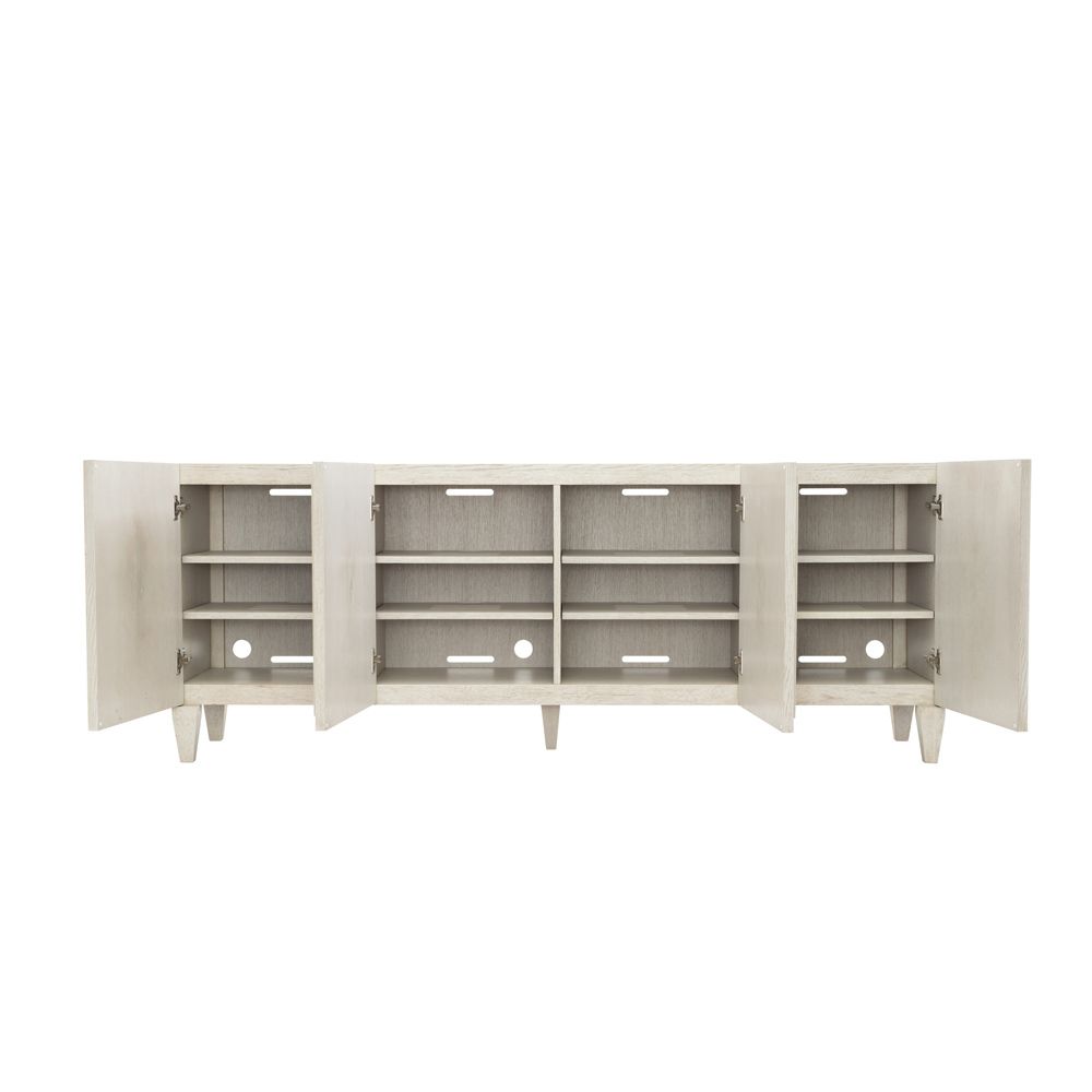A chic natural wood tv and entertainment unit with 4 doors and metal fixtures