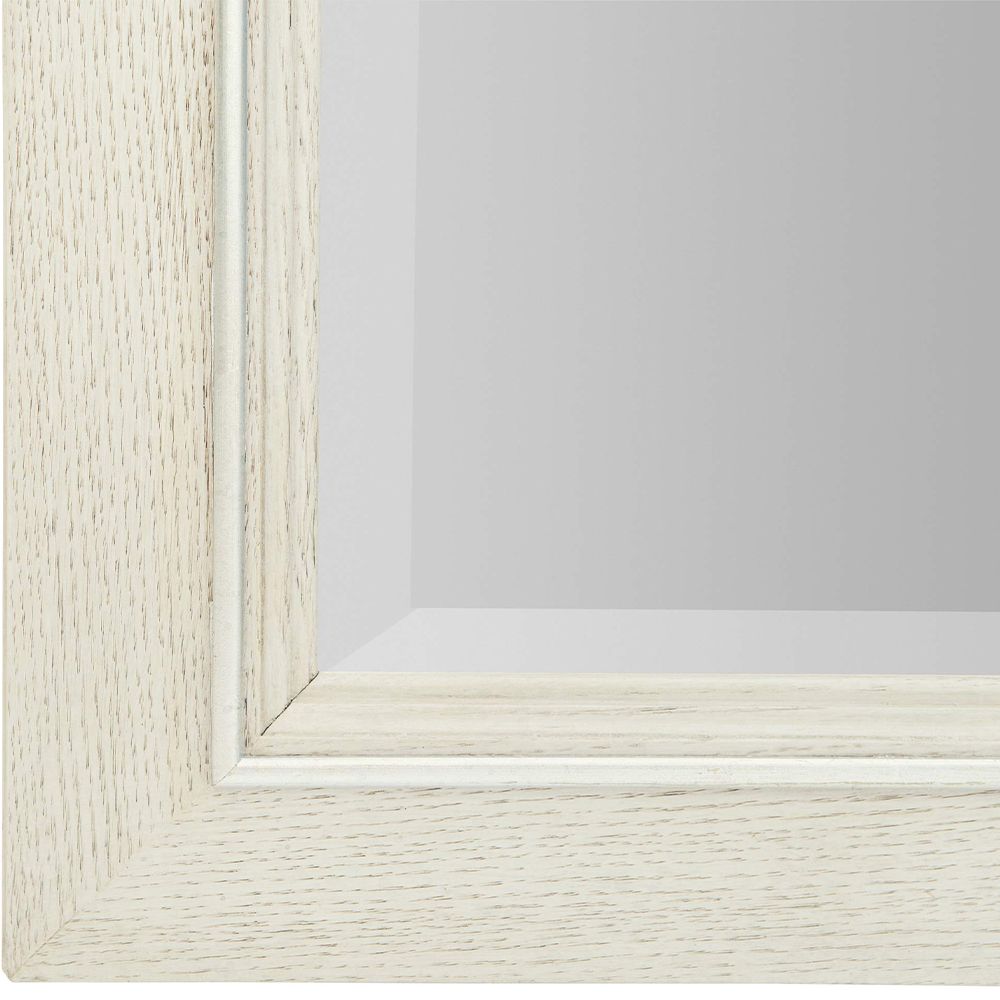 A contemporary rectangular mirror featuring a natural wood frame with a bevelled edge and a white finish