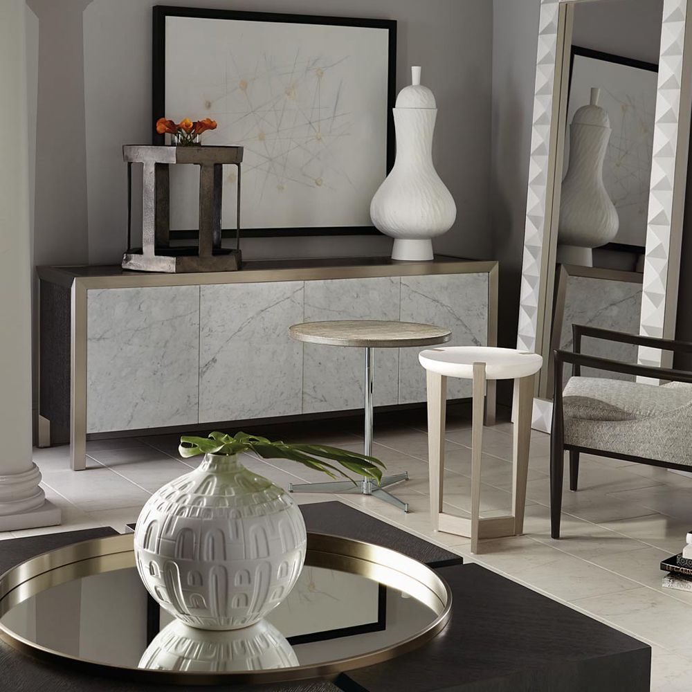 A sophisticated entertainment unit with four marble front doors, a dark brown top, silver frame and internal storage