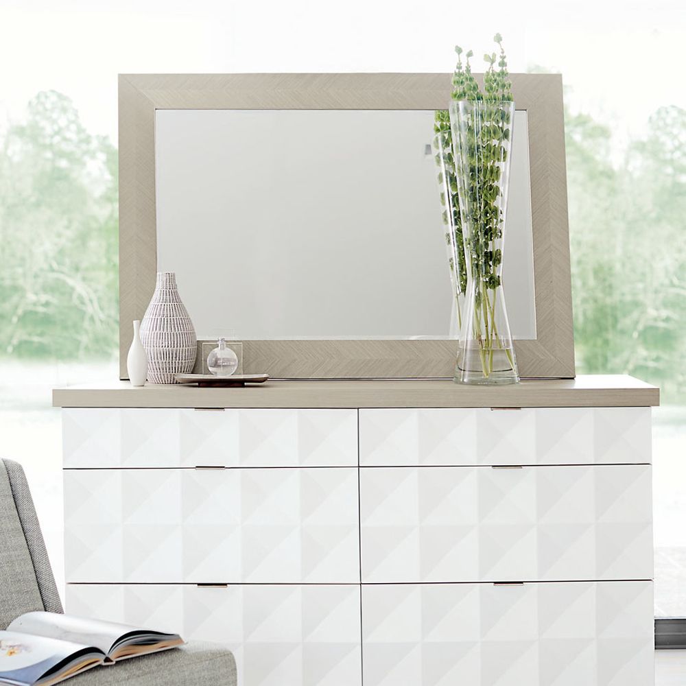 A modern and versatile wall mirror with a wooden frame that can be hung vertically or horizontally 