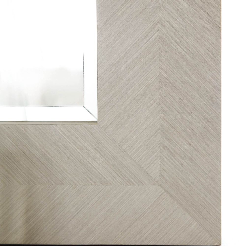 A modern and versatile wall mirror with a wooden frame that can be hung vertically or horizontally 