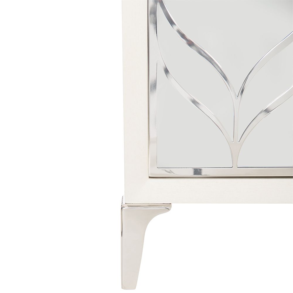A dazzling buffet with three mirrored glass doors featuring decorative stainless steel overlays and an abundance of internal storage 