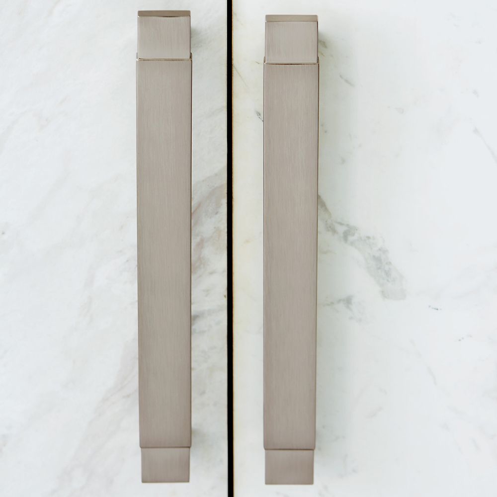A luxurious buffet featuring a dark brown finish, stainless steel frame and laminated marble front