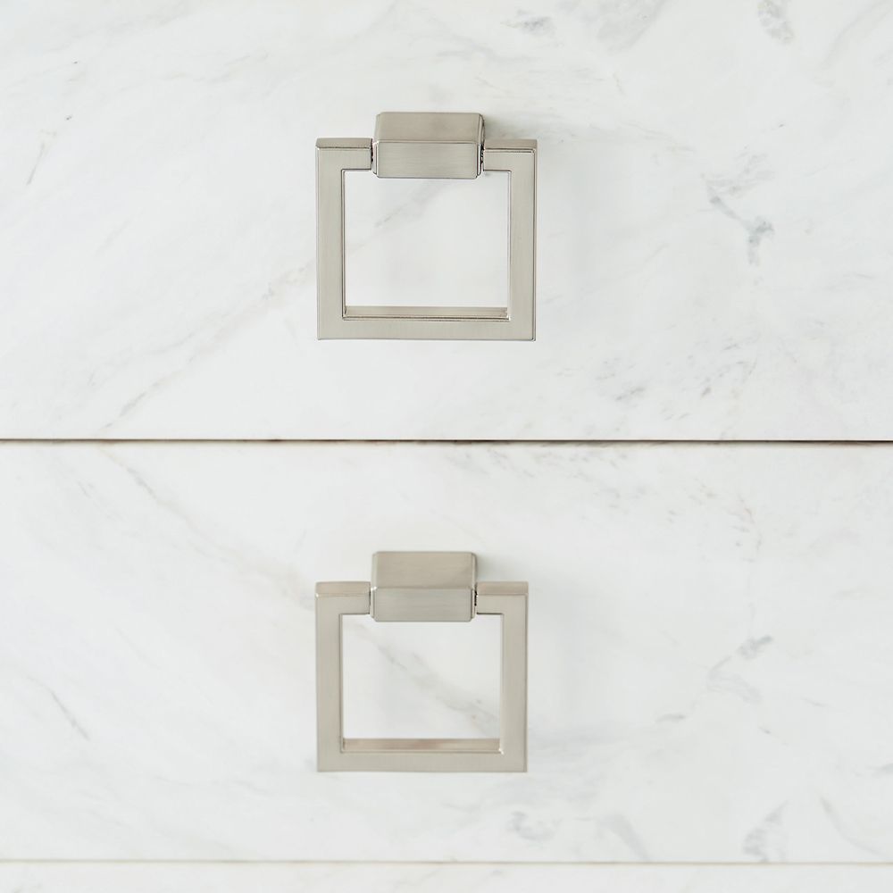 A luxurious buffet featuring a dark brown finish, stainless steel frame and laminated marble front