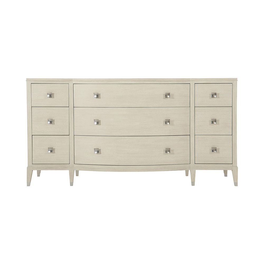 A gorgeous dresser from Bernhardt with a natural finish, tarnished nickel accents and nine drawers