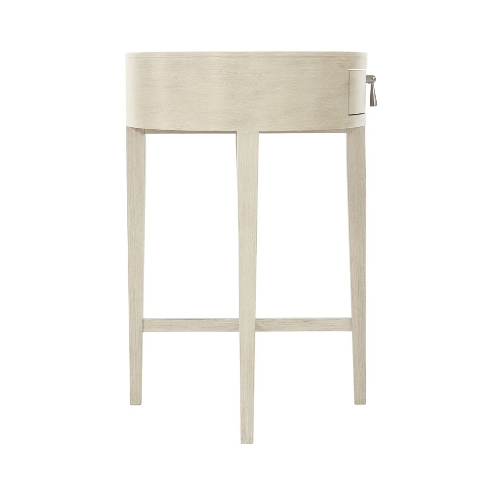 A lovely natural wood, one-drawer bedside table with nickel accents